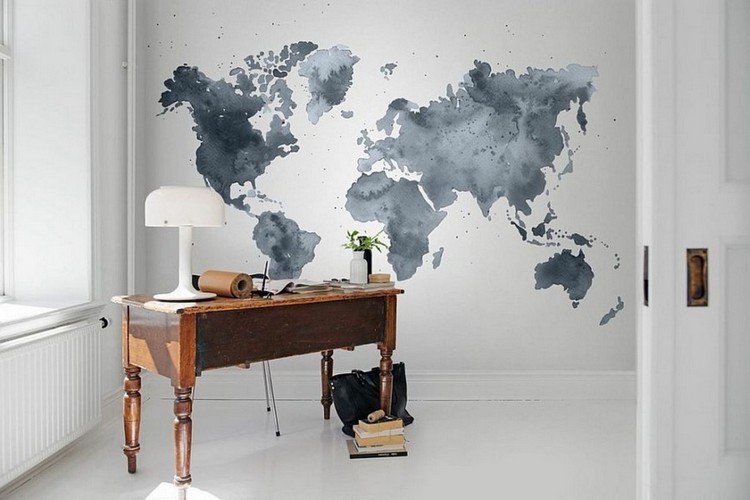 watercolor world map on the wall and an antique wooden desk in this minimalist home office Home Office: How To Create A Scandinavian Feeling
