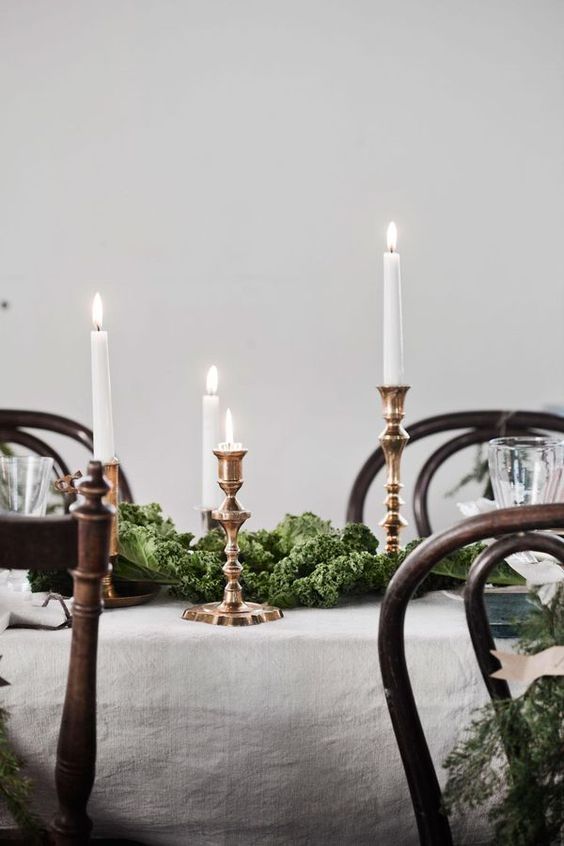 brass candlesticks on a dining table 50+ Most Beautiful Candlesticks You Can Buy Right Now