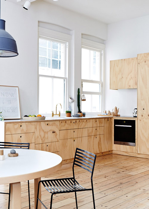 Studio apartment with a plywood kitchen