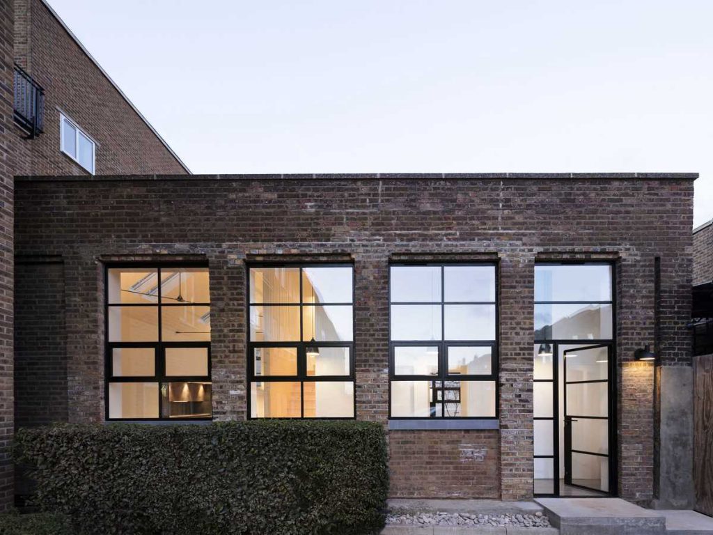 Dilapidated warehouse conversion into a light-filled house