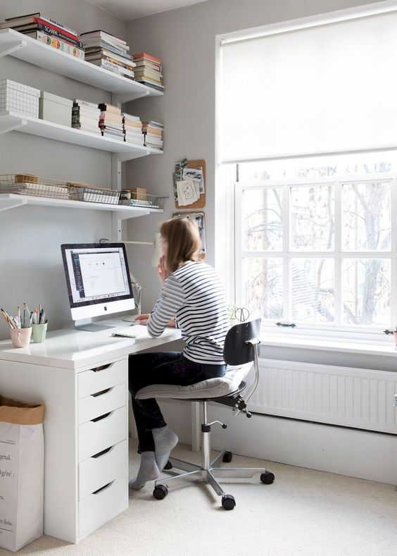 workspace with some shelving How To Design The Perfect Office For Your Home