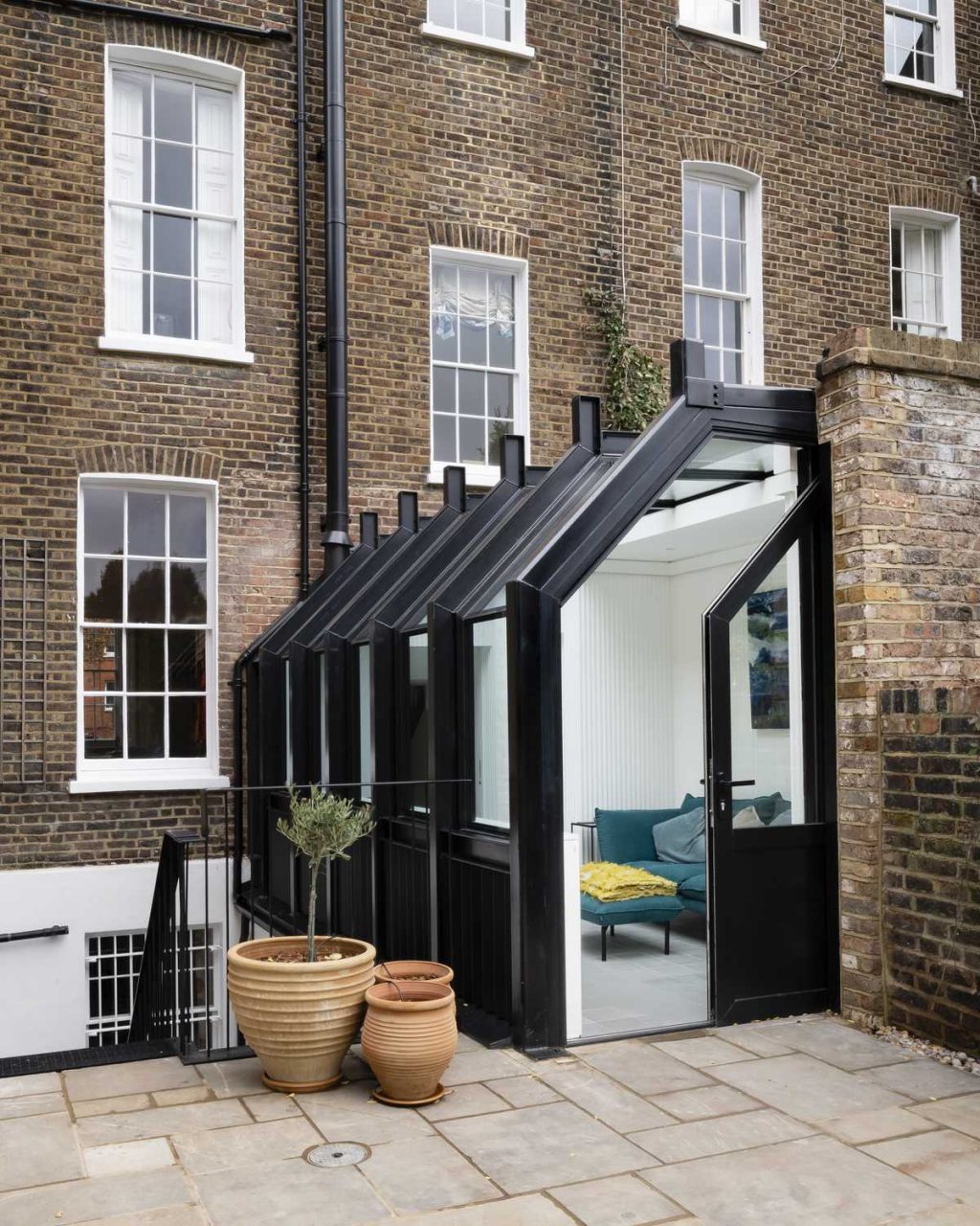 A glasshouse re-connects a Listed townhouse to its garden