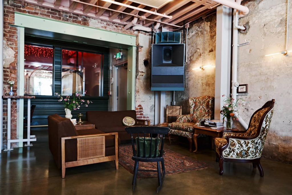 mismatched furniture 1024x683 Craft Brewery Built in a Century old Brick Building