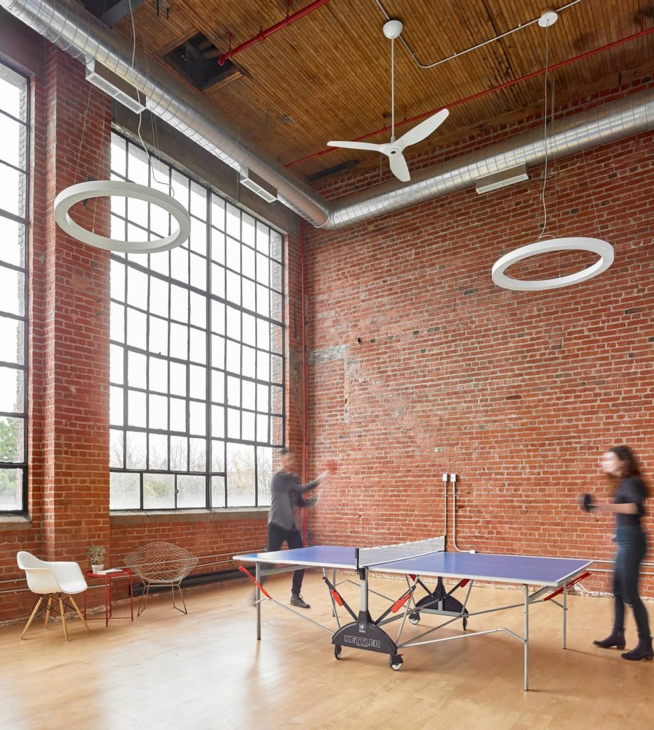 16-foot-tall original factory windows framed in black metal