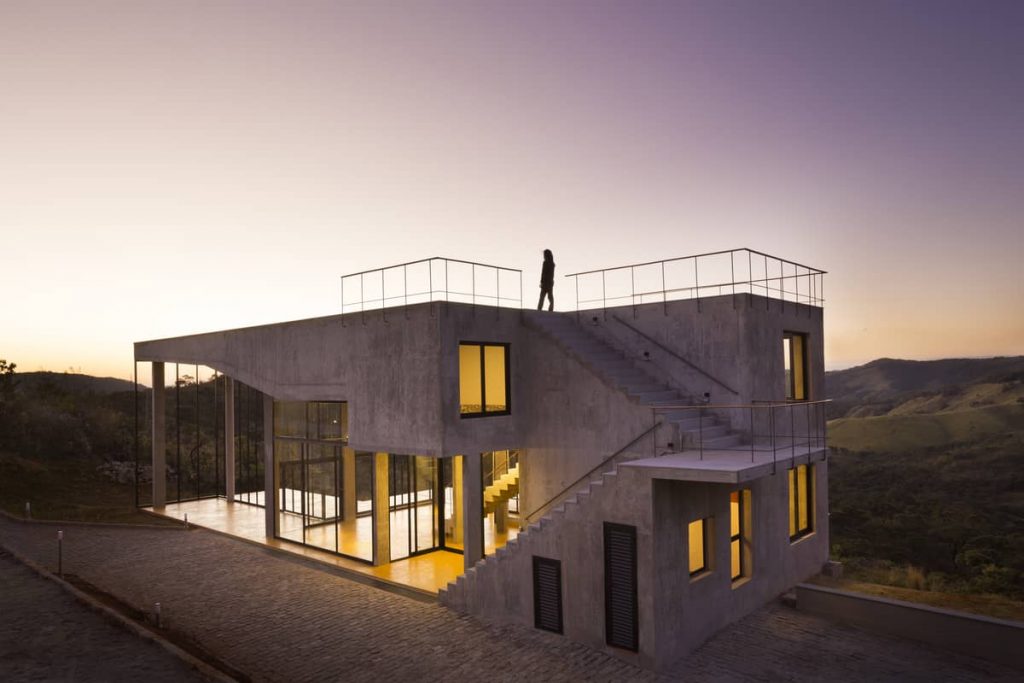 at sunset 1024x683 A Modern Concrete House In Brazil With Stunning Views Of The Sierra da Moeda