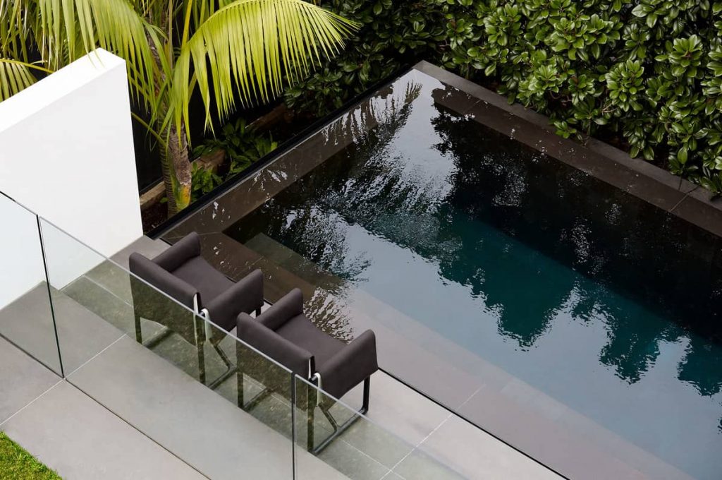 basalt lined swimming pool 1024x680 A House Designed Around the Sculptural Form Of a Large Angophora Tree