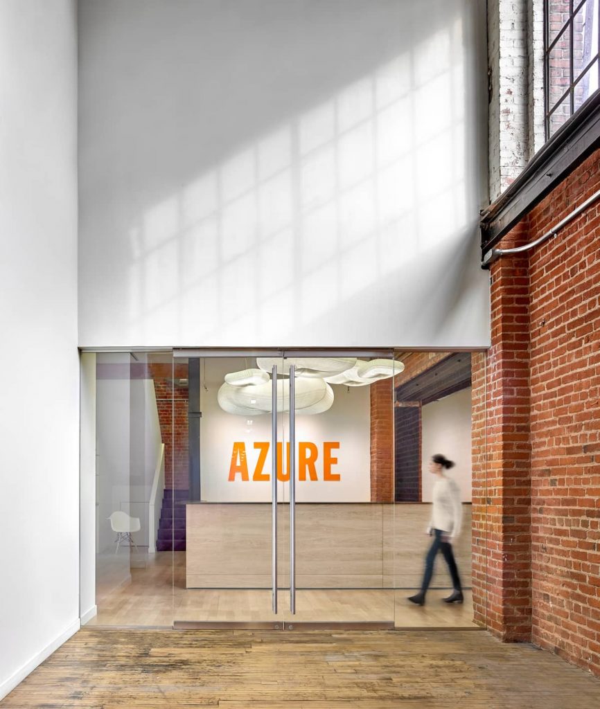 reception and logo 866x1024 An Old Transformer Factory Was Converted into a Bright Office