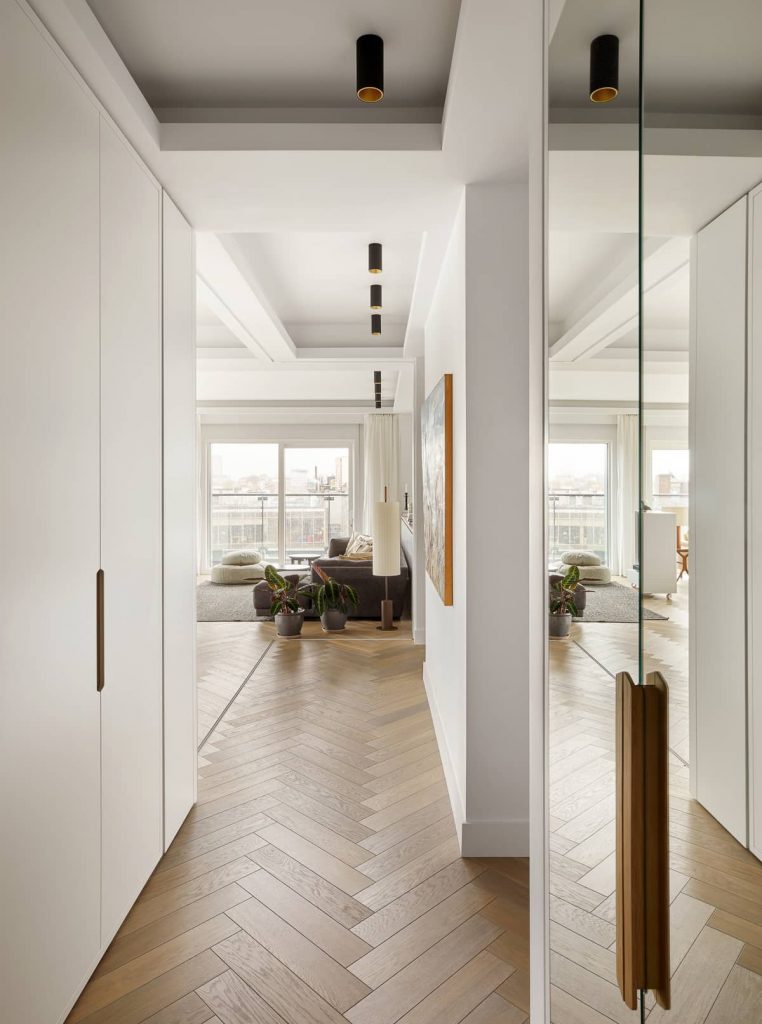 Apartment entrance with large mirrors