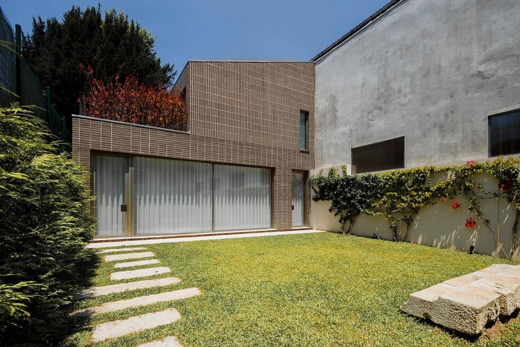 backyard 1024x683 Miguel Bombarda Residential Building by Paula Santos Arquitectura