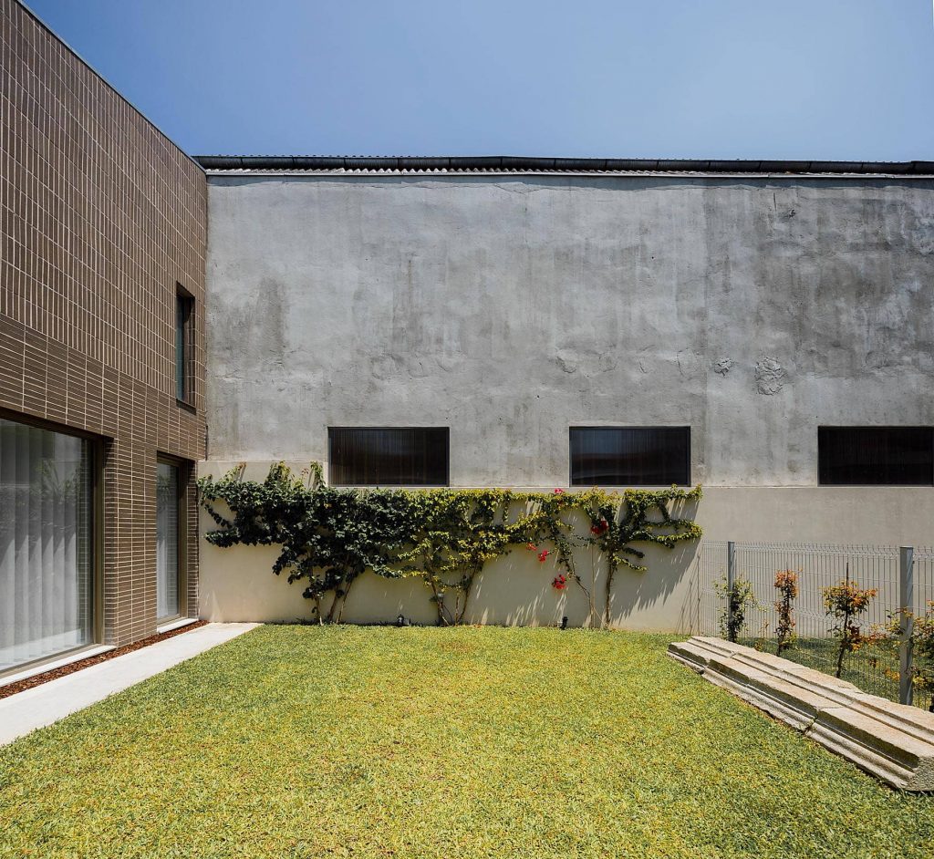 brick and white facade 1024x942 Miguel Bombarda Residential Building by Paula Santos Arquitectura