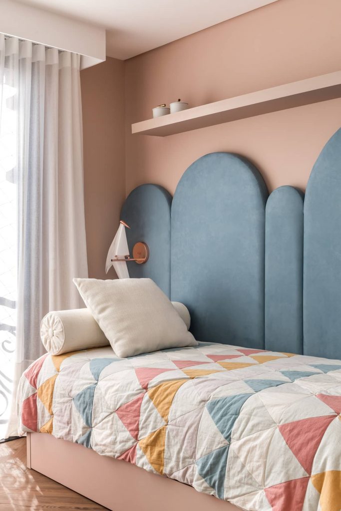 daughters bedroom with a blue headboard 683x1024 Colorful Apartment Interior by TN Architecture