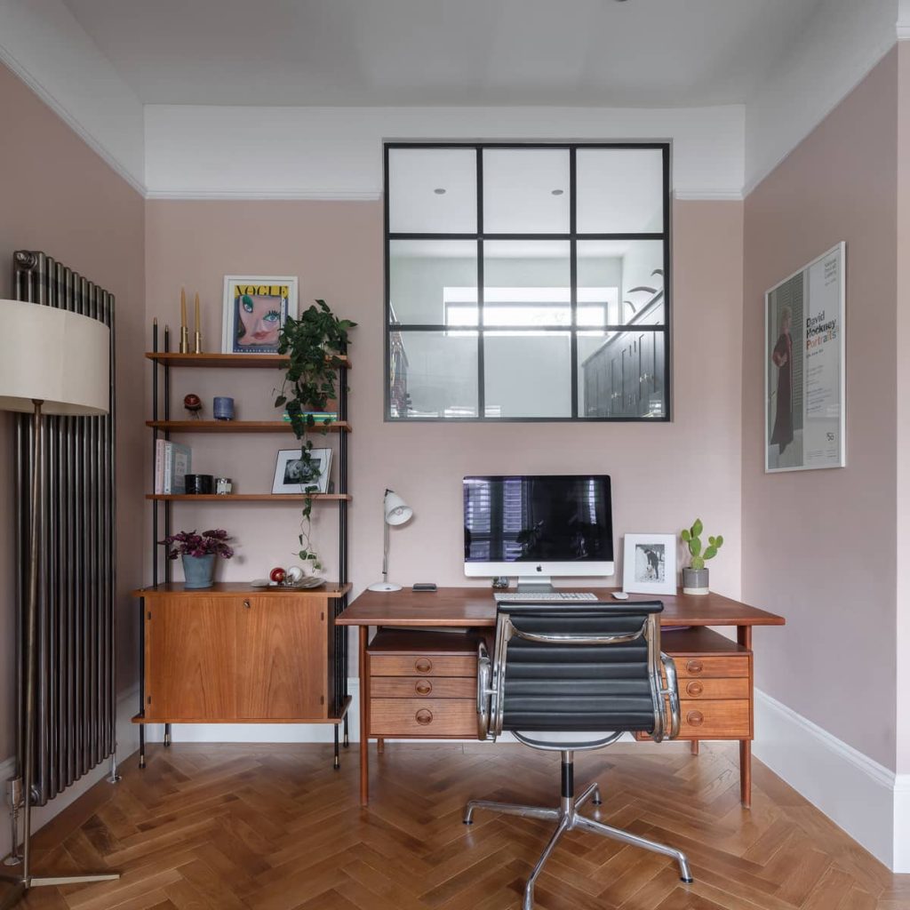 Home office with an internal window