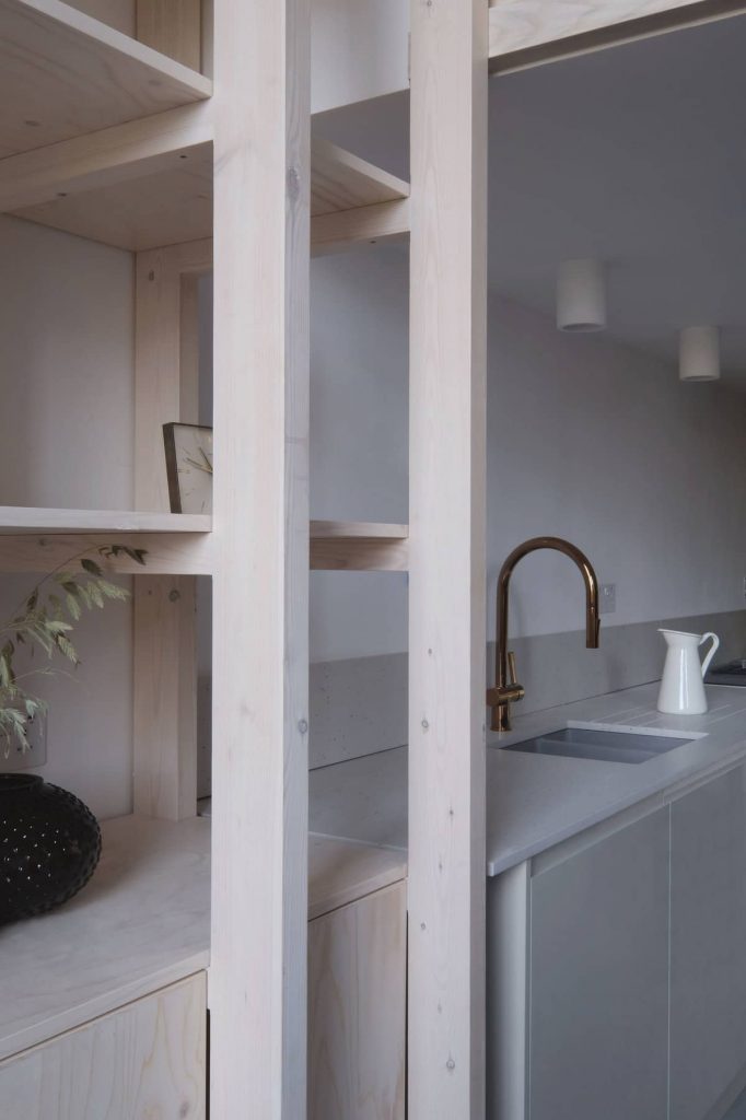 kitchen and storage 682x1024 A Converted Matchstick Factory Becomes a Beautiful Apartment