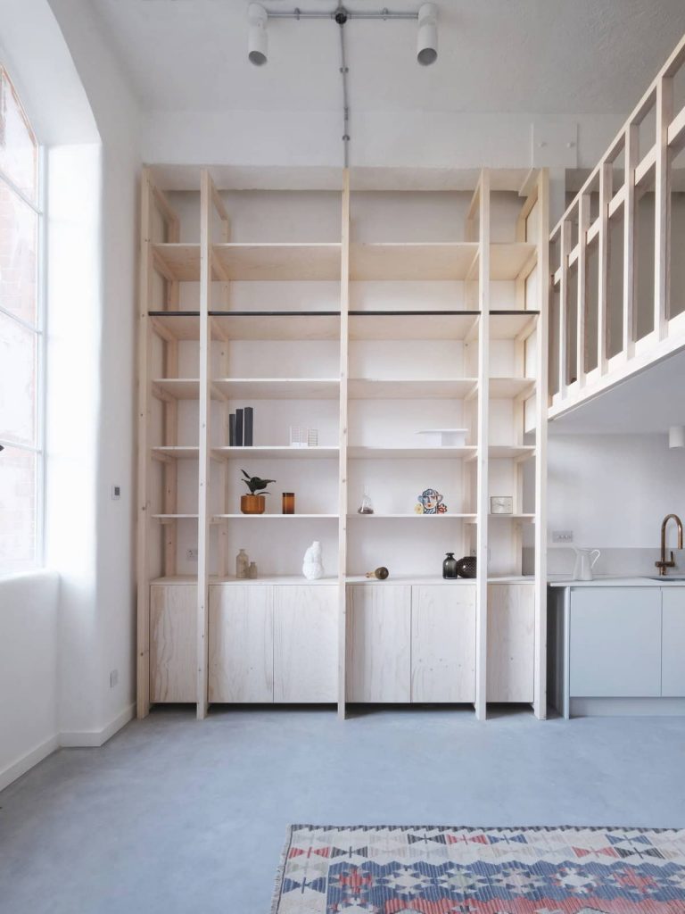 mezzanine and storage shelves 768x1024 A Converted Matchstick Factory Becomes a Beautiful Apartment