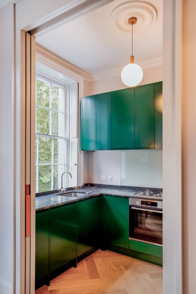 Kitchen cabinets painted in green