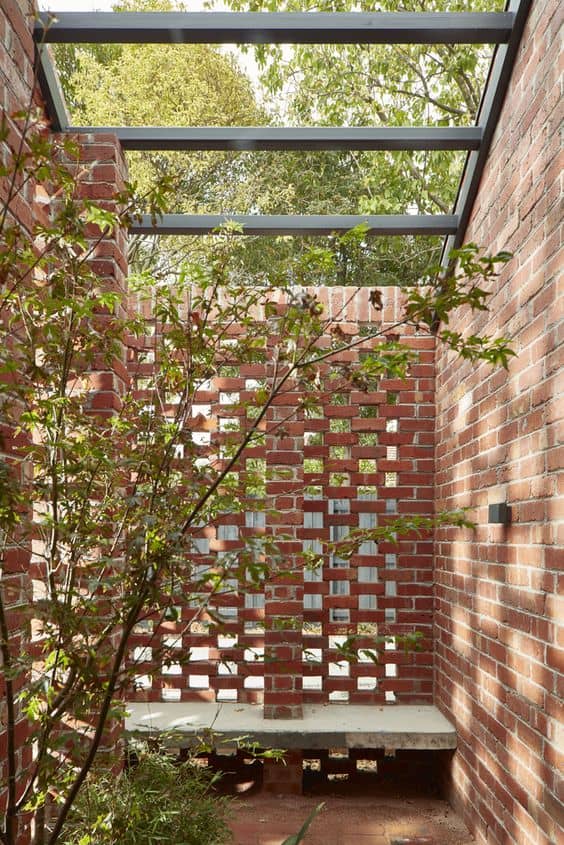 perforated brick patio wall 14 Patio Wall Ideas That Will Make Your Outdoor Space More Attractive