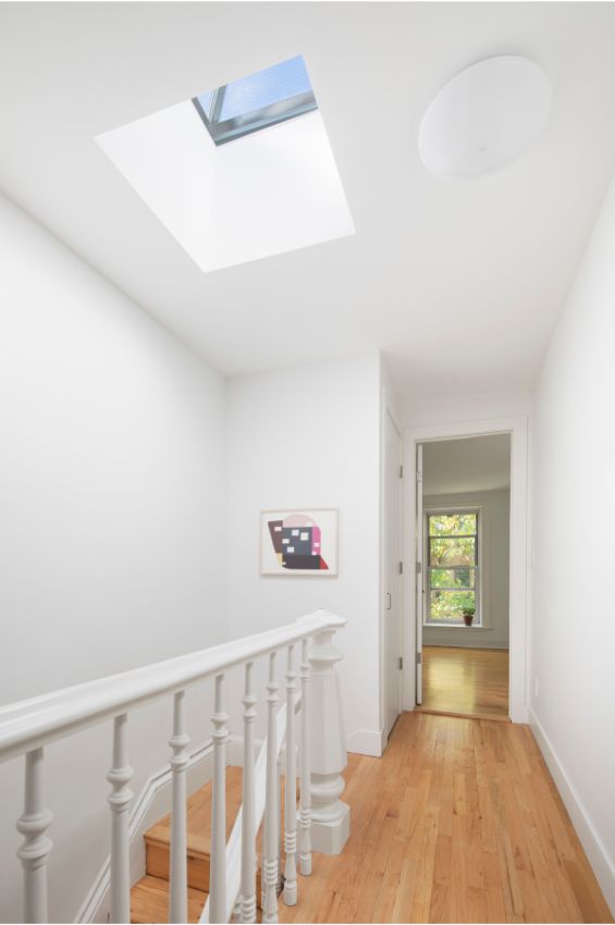 bedroom hallway 100 Year Old Townhouse Renovation by Studio Officina Architecture