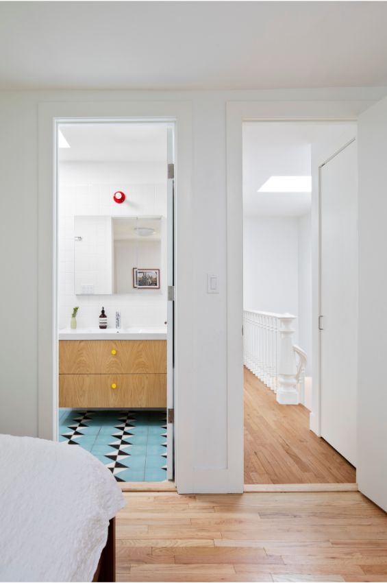 primary bedroom and bathroom 100 Year Old Townhouse Renovation by Studio Officina Architecture