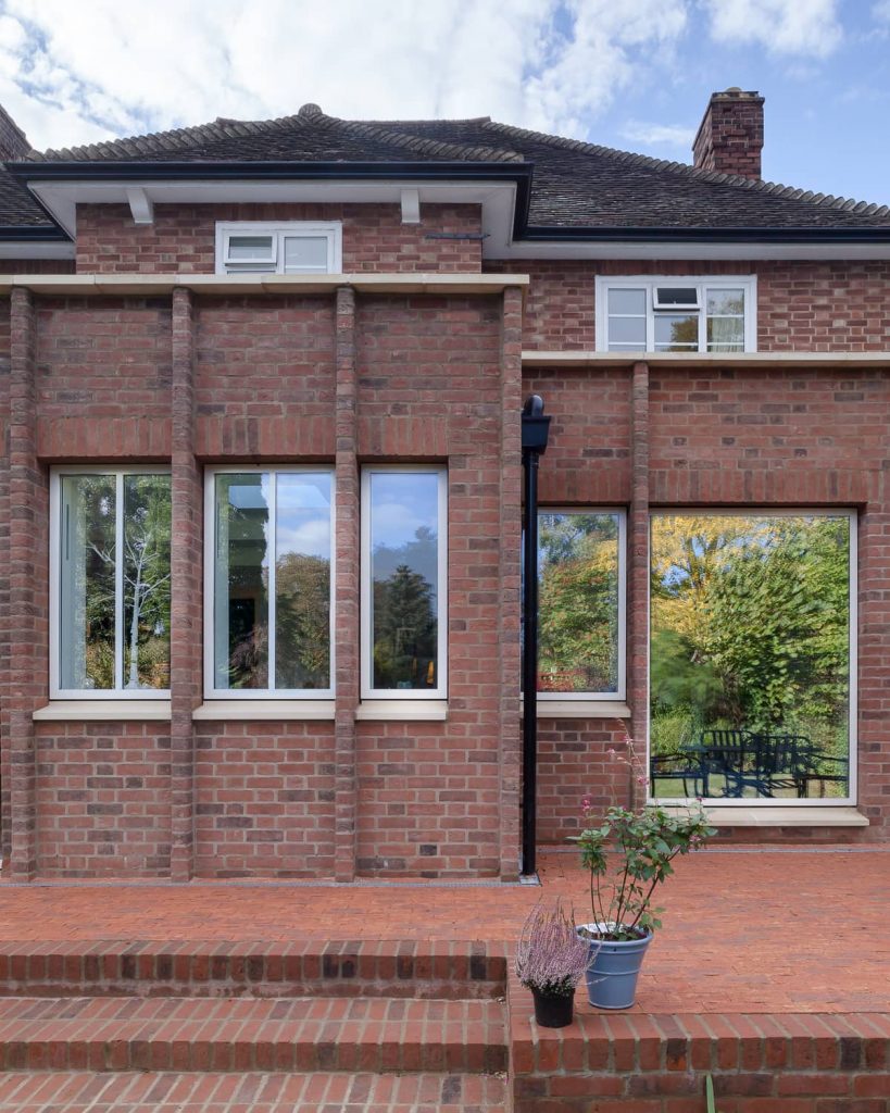 red brick facade and white windows 819x1024 A Renovation of a Detached House in a Cambridge Conservation Area