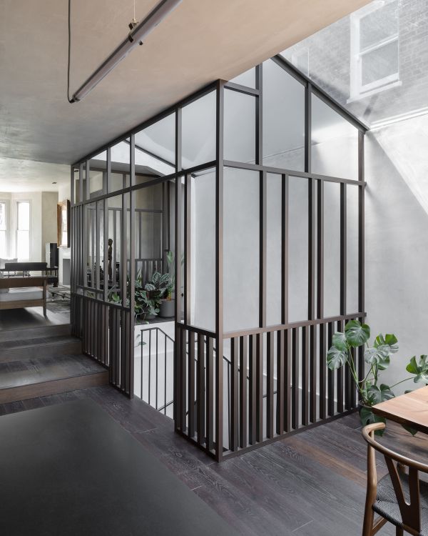 view of the wooden box connecting to the basement Unagru Architects Transformed a Traditional Terrace Into a Bright Home