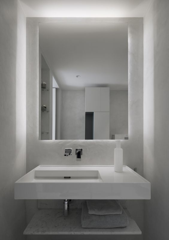 en suite bathroom Name Architecture Refurbished Two Parisian Apartments to Create a Unique Family Dwelling