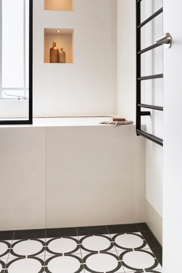 bathroom with lights on An 80sqm Apartment Renovation by Brosh Architects