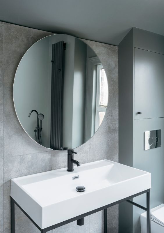 bathroom mirror A Material Driven Overhaul to a Victorian End Of Terrace by NOTO