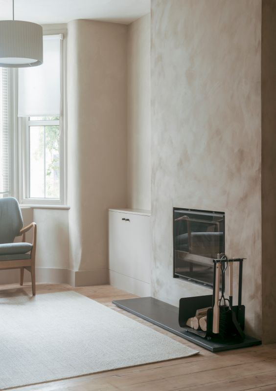 living room with a fireplace A Material Driven Overhaul to a Victorian End Of Terrace by NOTO