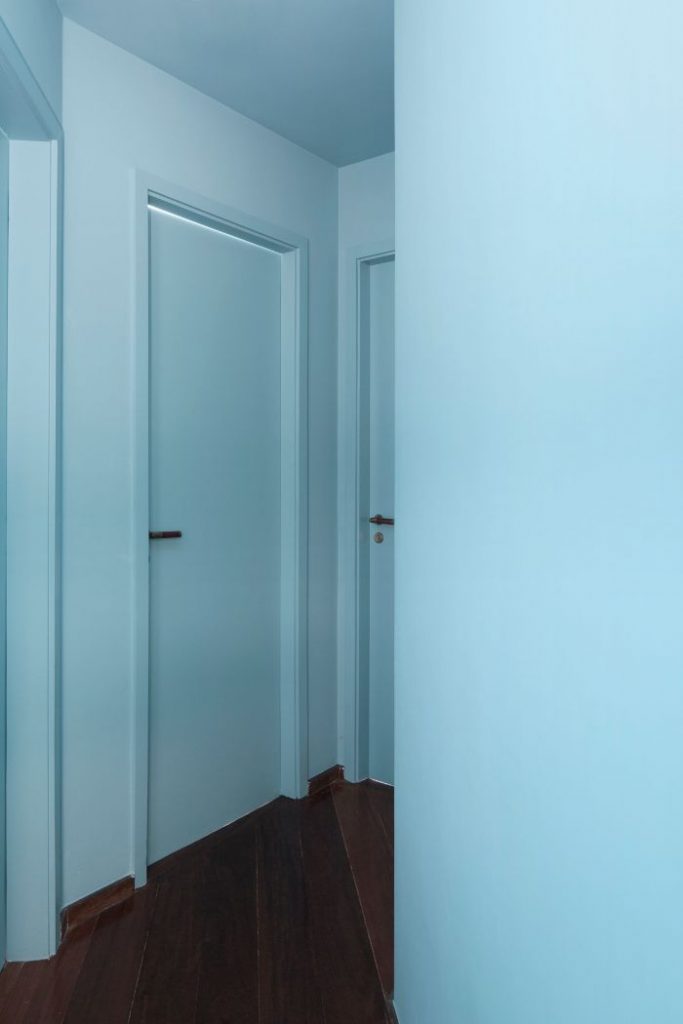 blue corridor 683x1024 A Quick Transformation of a 146 m² Apartment by Angá Arquitetura
