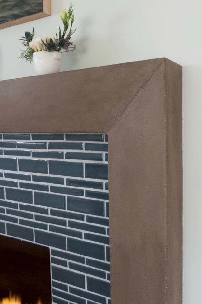 concrete fireplace with linear etchings An Ocean Inspired Home for a Family to Grow Designed by Sarah Barnard