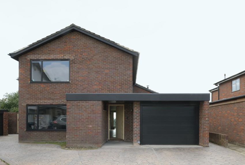 a modern facade A Complete Renovation and Extension of a 1960’s House by CAIRN