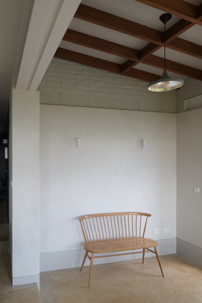 a place to sit in the lowered dining area A Complete Renovation and Extension of a 1960’s House by CAIRN