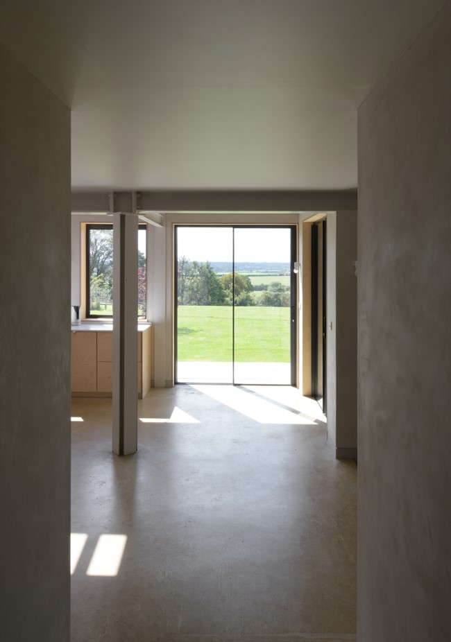 the view is framed from the hallway A Complete Renovation and Extension of a 1960’s House by CAIRN