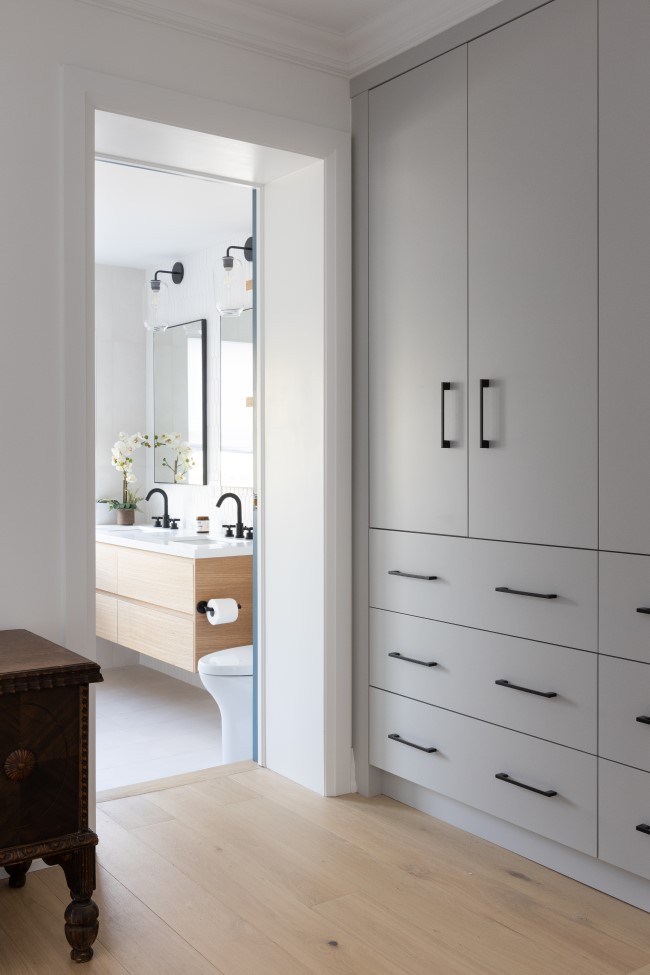 view to the master bathroom Nunnery Transformed Into a Modern Family Home by Sansa Interiors