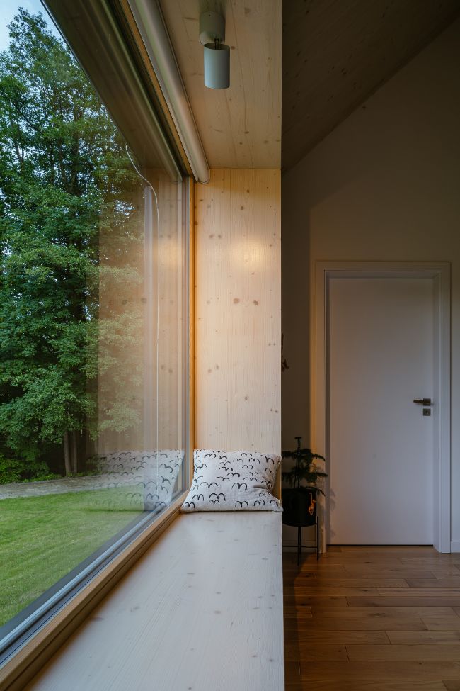 wide window seat for relaxation House with In law Suite by KLAR