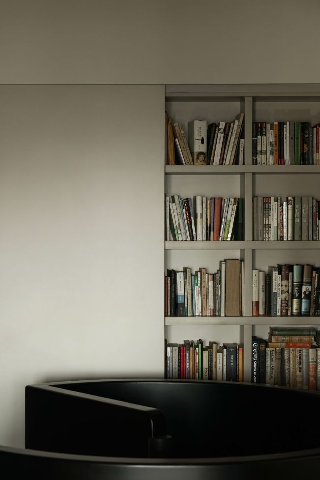 bookshelf A Mid Century Revival of a 2 Story Apartment by JAAK