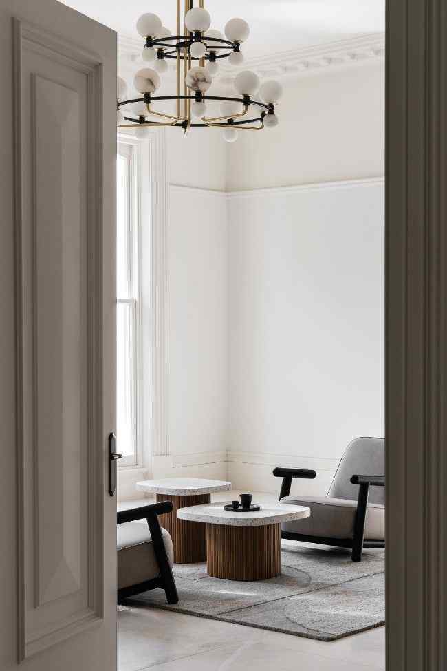 living room through door 19th Century Victorian Italianate Home Restoration by Embrace Architects