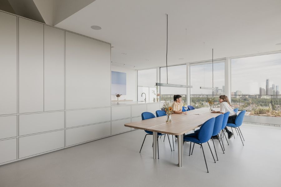 dining room Bureau Fraai Added Free Standing Oak Volumes to This Luxurious Penthouse