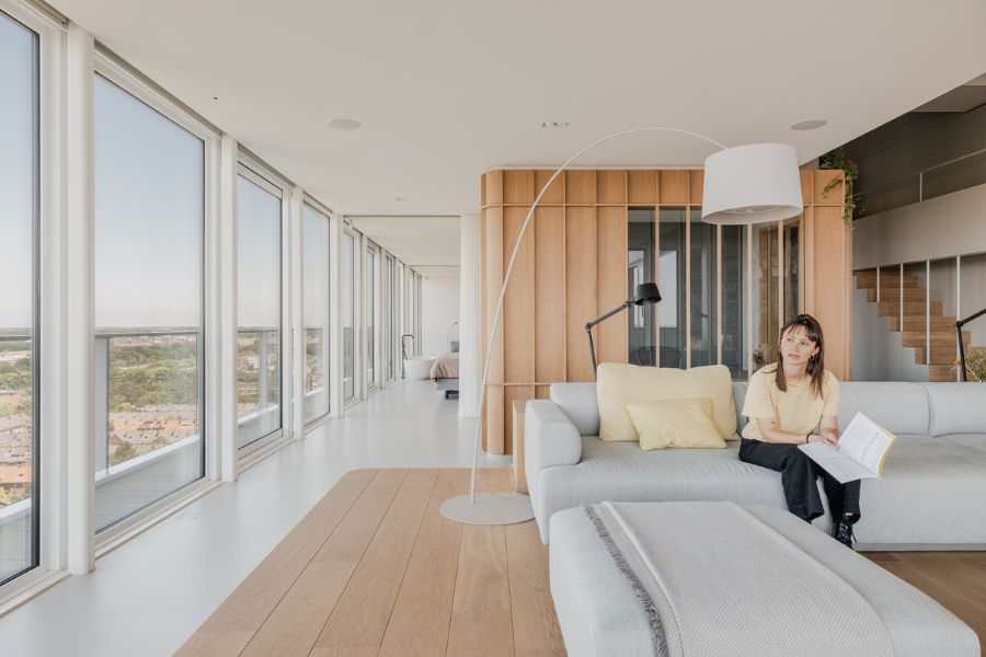 living area Bureau Fraai Added Free Standing Oak Volumes to This Luxurious Penthouse