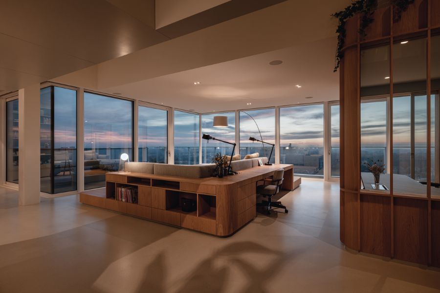 living room at evening Bureau Fraai Added Free Standing Oak Volumes to This Luxurious Penthouse