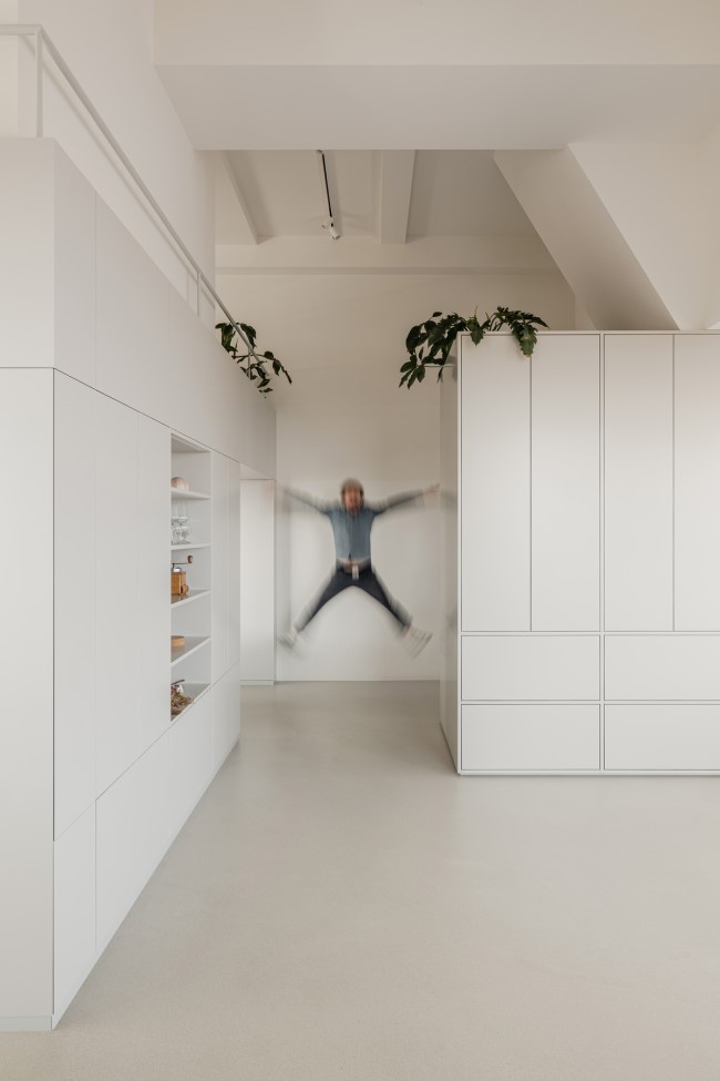 white and grey colors Bureau Fraai Added Free Standing Oak Volumes to This Luxurious Penthouse