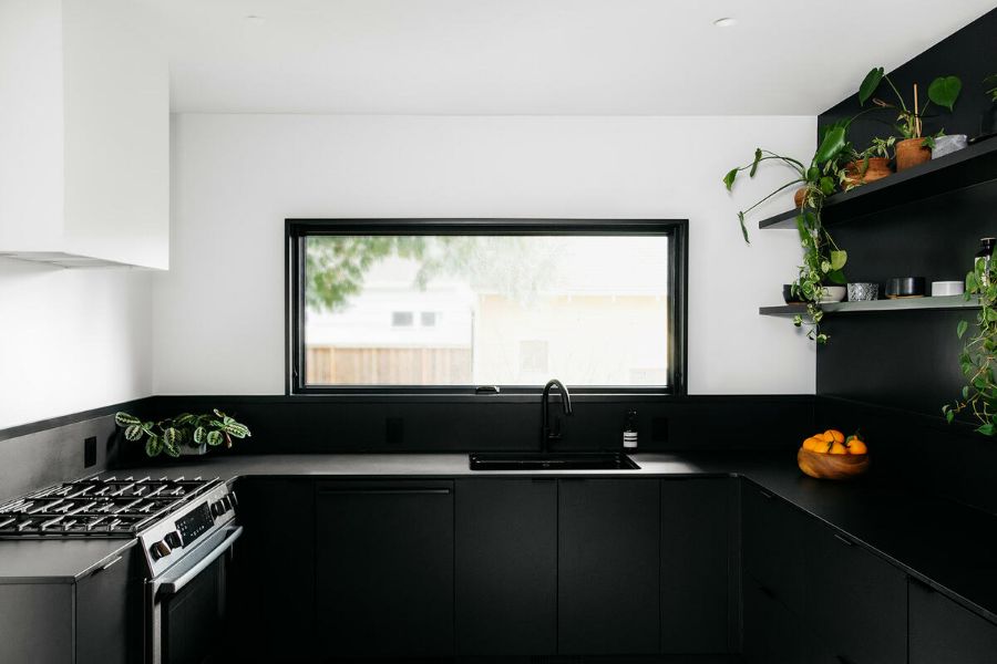black kitchen cabinets A Modern Whole House Renovation by Ment Architecture LLC
