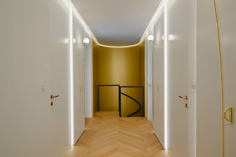 brass colored covering Luxurious Apartment in Ljubljana by Gao Architects