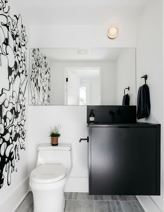 half bathroom A Modern Whole House Renovation by Ment Architecture LLC