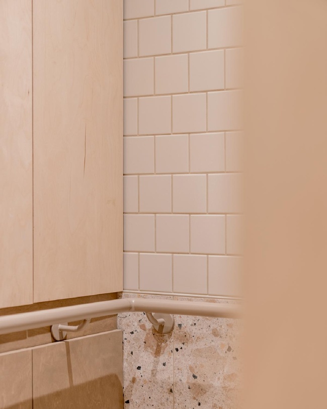 white tiles and handlebar Accessible Bathroom Design by Studio Kloek